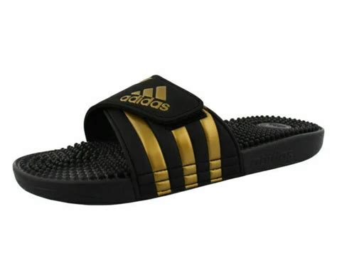 adidas Unisex Adissage Slides Sandal, Black/Gold 